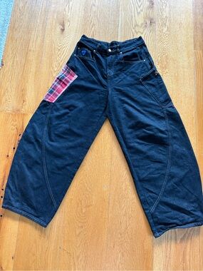 Never worn, women’s black pants with red plaid accent side pocket